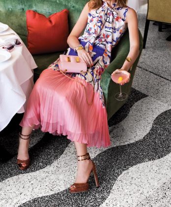 Pleated skirt ($3,590), double-georgette top ($1,140), Emilio Pucci, Palm Beach; Mayner platform heels ($895), Jimmy Choo, Palm Beach; Tom Ford handbag ($2,950), Alexis Bittar ram head bracelet ($275), Neiman Marcus, Palm Beach; Celine geometric bangle ($590), circle bracelet ($510), Gypsy, Palm Beach; sunglasses ($450), Gucci, Palm Beach.