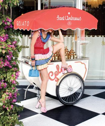 Alexander McQueen knit dress ($1,745), Neiman Marcus, Palm Beach; denim platform sandals ($995), Prada small tote ($2,230), Saks Fifth Avenue, Palm Beach; Mark Davis embellished bakelite bangles ($1,500 - $4,100), Betteridge, Palm Beach.