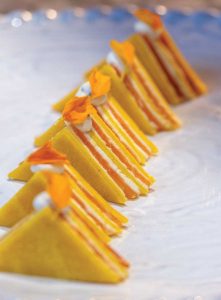 Salmon gâteaux with layers of saffron crepe, smoked salmon, and lemon crème. Photography by Jerry Rabinowitz