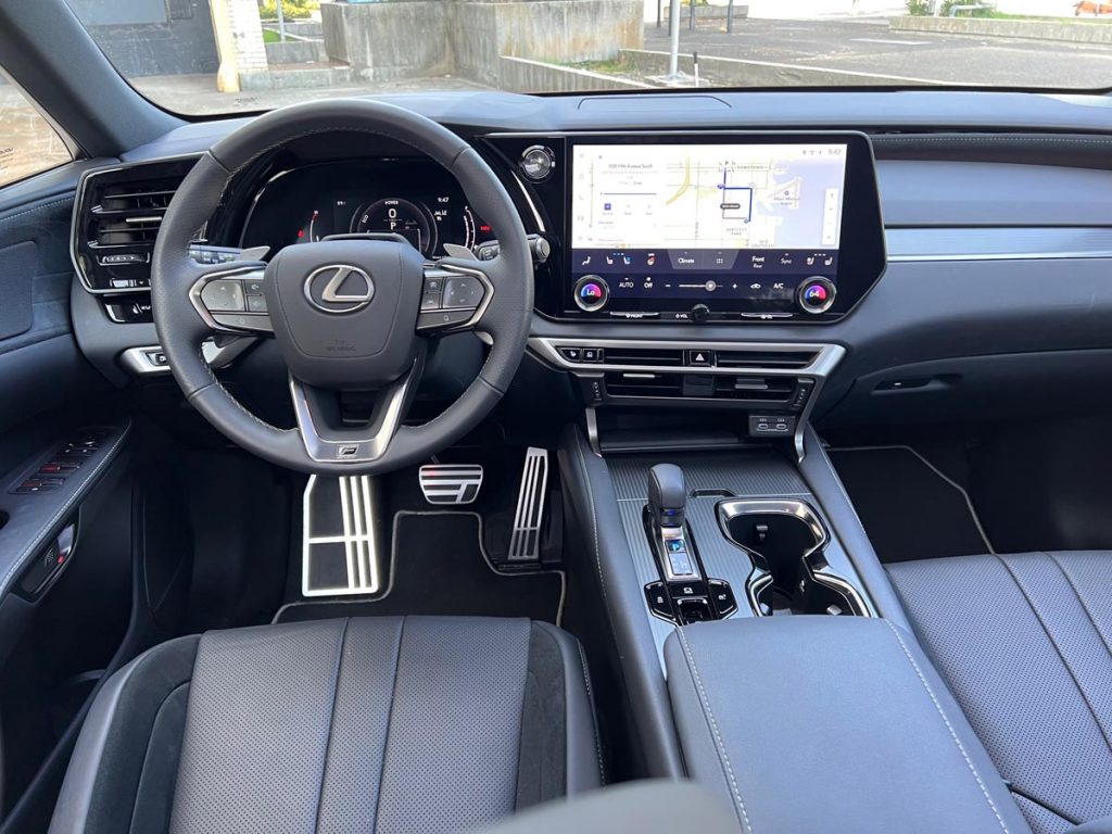 Lexus RX500h F Sport Performance AWD, steering wheel, dashboard, 14-inch touchscreen.