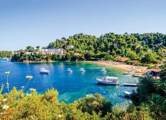 An Aegean Odyssey Troulos Beach in Skiathos is known for its crystal-clear, calm water. Photo courtesy of iStock