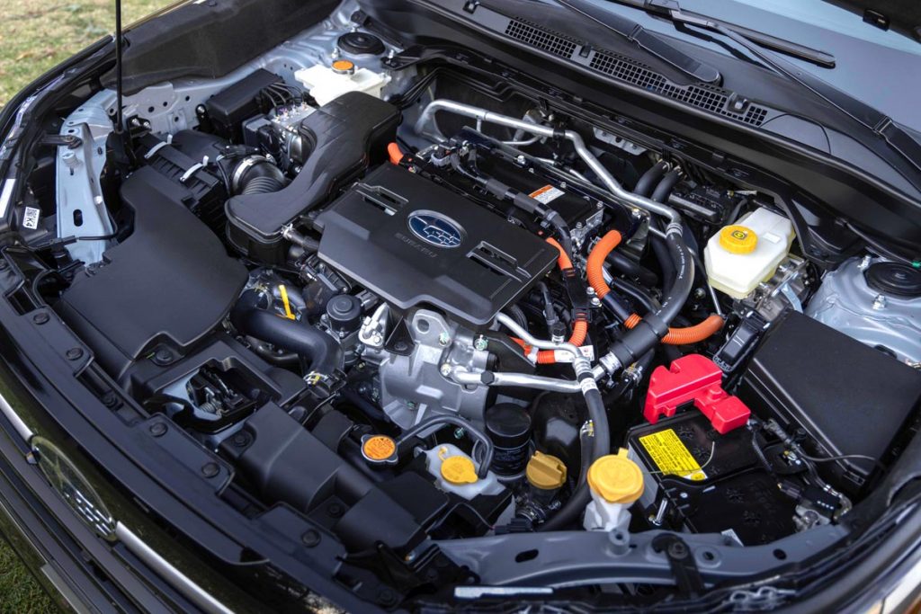 The newly developed 2.5-liter four-cylinder engine under the hood. Photo by Howard Walker