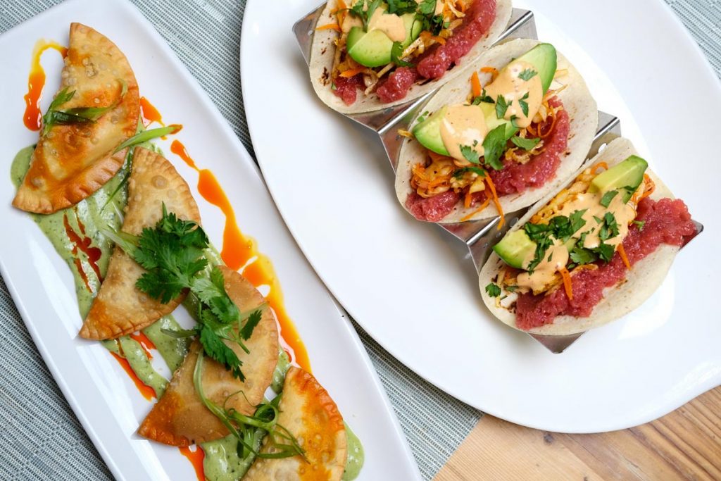 Spicy tuna tacos and vegan chorizo empanadas. Photo courtesy of Farmer’s Table/Kip Hunter Marketing