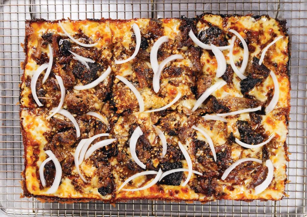 Death by Pizza launched its Collab Pie Summer with the chopped beef brisket pizza. Photo by Koby Wexler