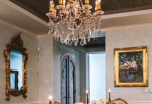Three Palm Beach Tastemakers Set Tables with Style The antique obi table runner gives way to custom-made candleholders, ceramic flowers, frog place-card holders, and demure floral arrangements. Photo by Nick Mele