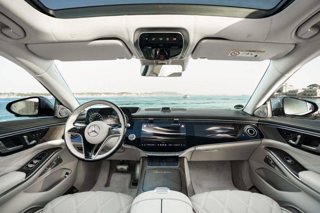 The display integrates a 12.3-inch driver's screen, a 14.4-inch central infotainment display, and a 12.3-inch screen for the passenger. Photo courtesy of Mercedes-Maybach