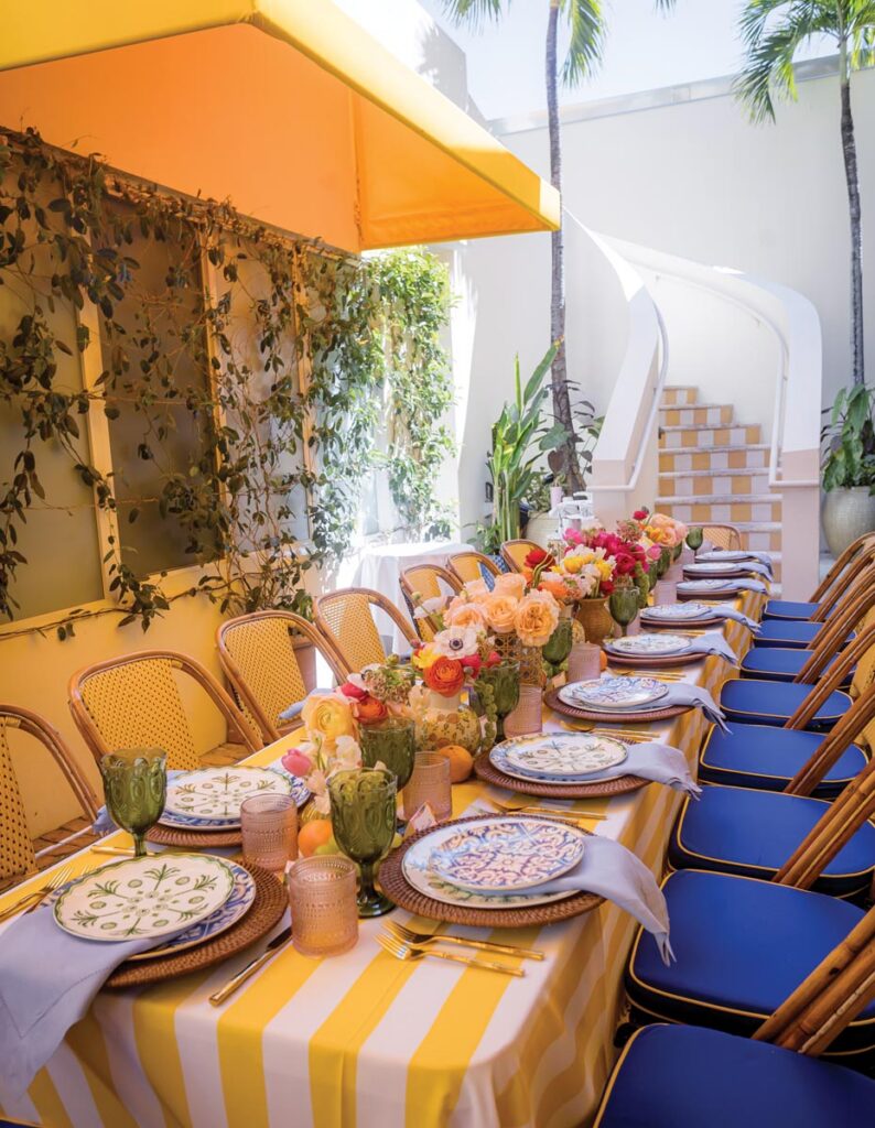 Elyce Arons echoed the striped steps at Le Bilboquet in her table, complementing the yellow and white tablecloth with other happy hues and pops of fruit. Photo by Joriann Maye-Keegan