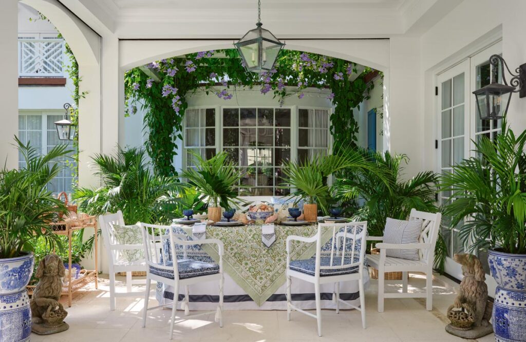 The pristine white loggia in this Palm Beach home